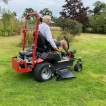 Reverse view of the ride-on lawnmower in action